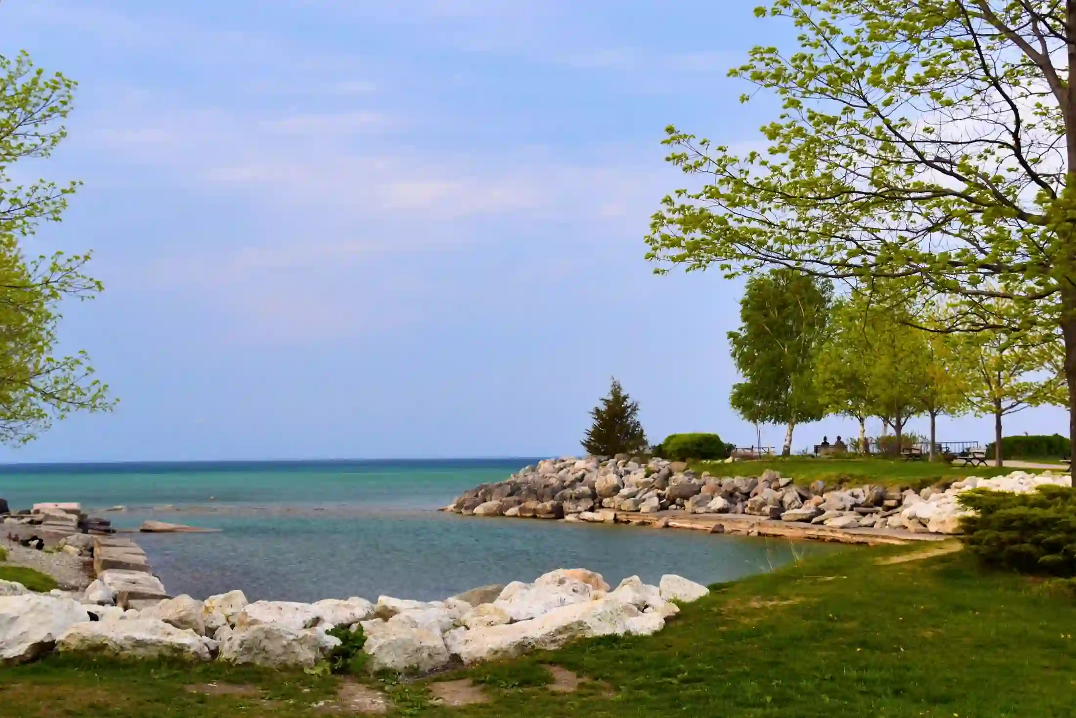 Turquoise Georgian Bay water along Collingwood's rocky shoreline