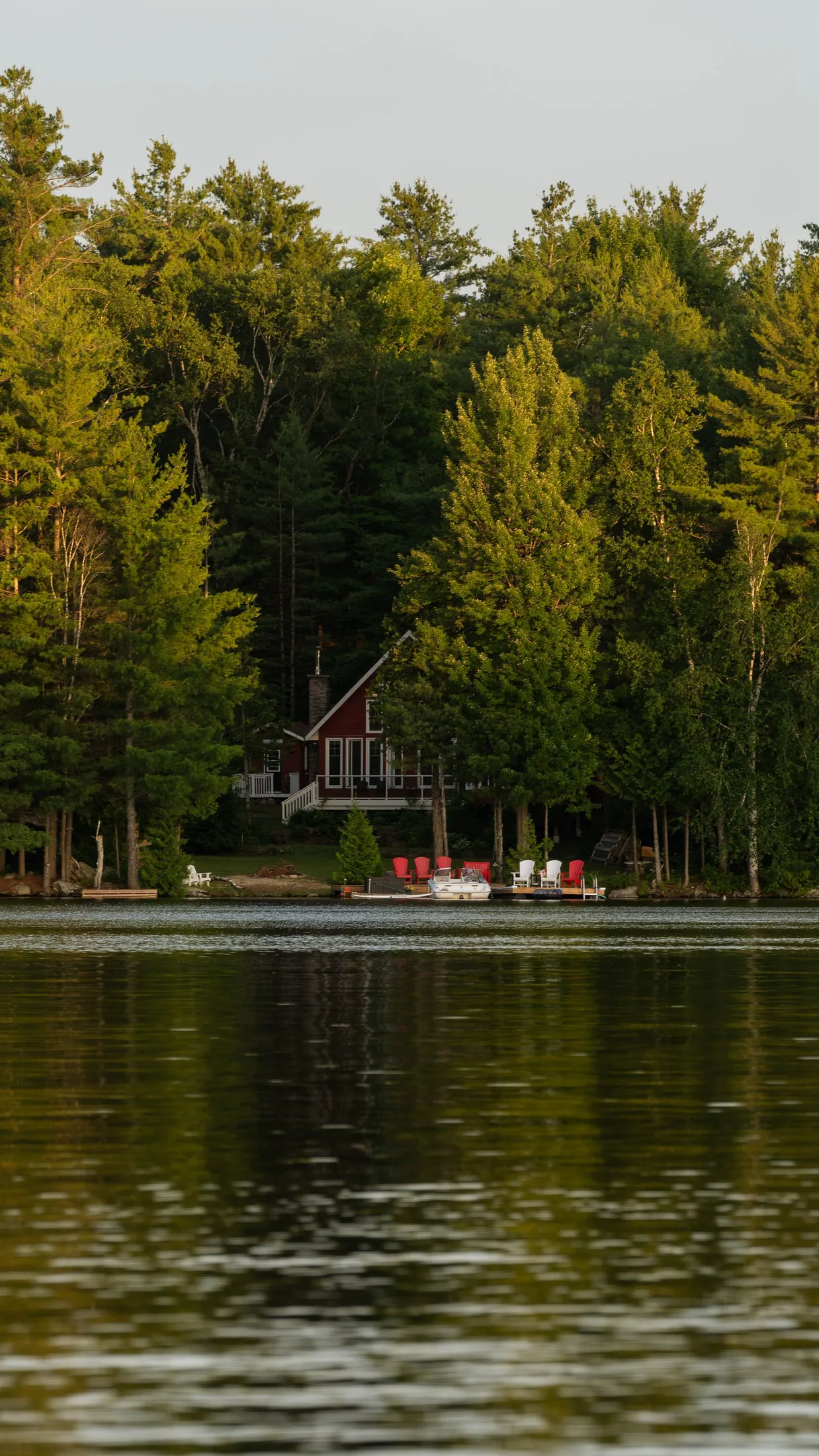 A lakeside cabin tucked into the trees in Muskoka