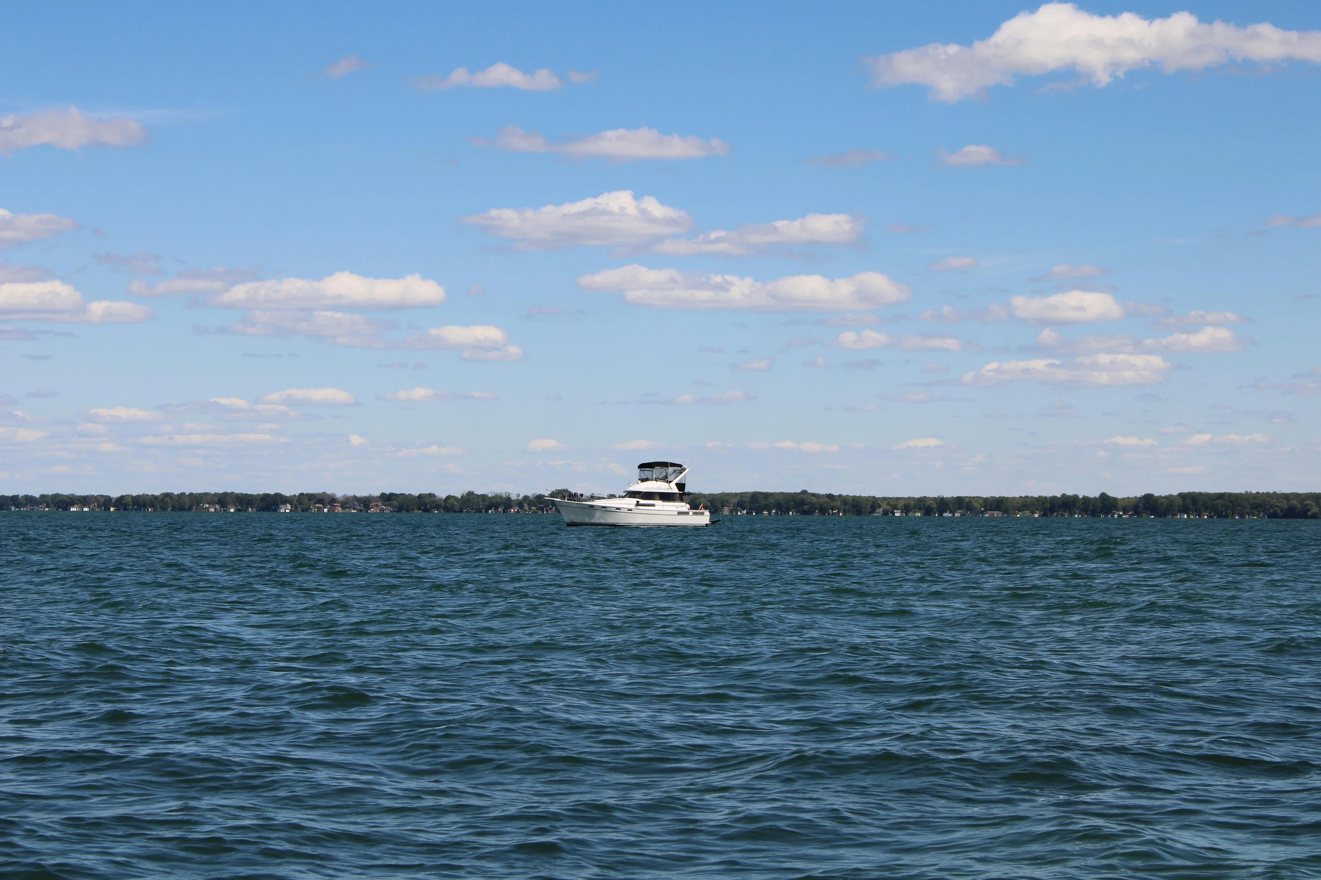 A cabin cruiser out on open water on Lake Simcoe