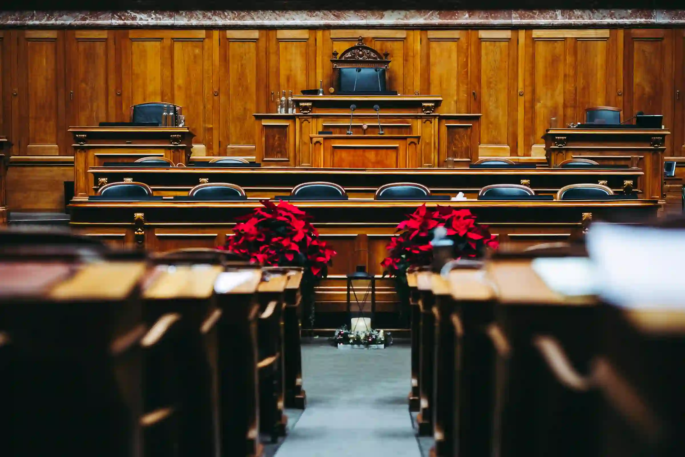 An empty wood-panelled courtroom chamber