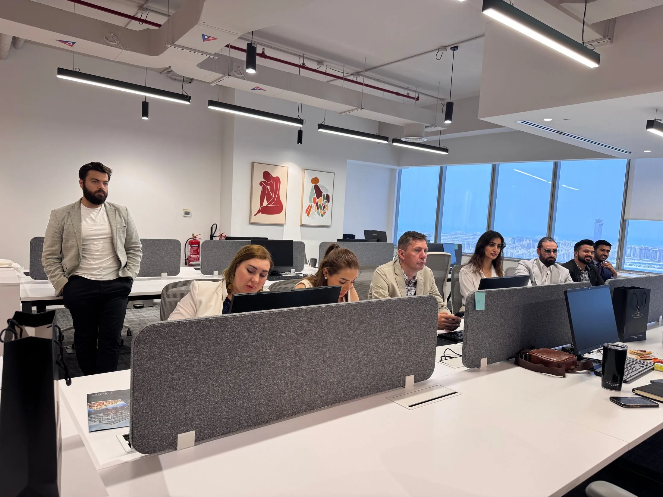 A team at work at their desks in a modern open-plan office