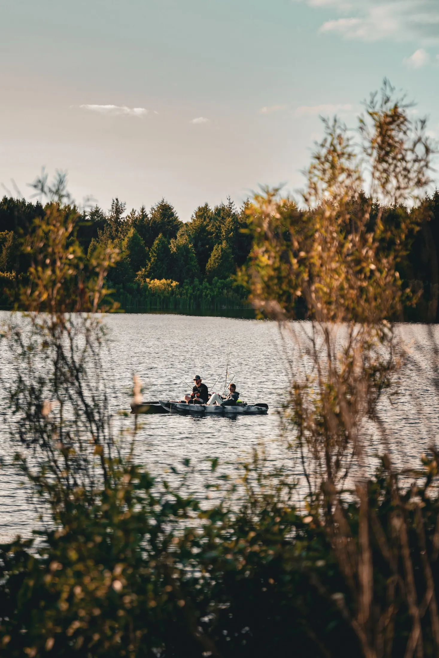 Two people canoeing on a lake near Orangeville at sunset