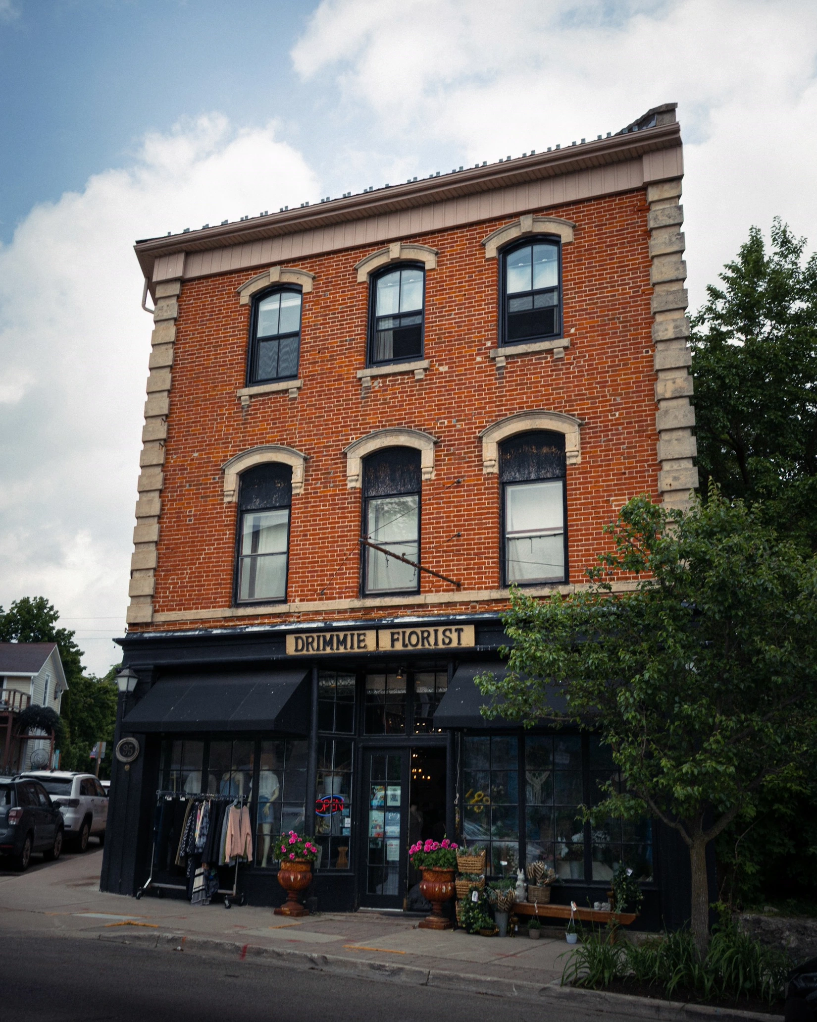 A heritage brick storefront on a small-town Main Street